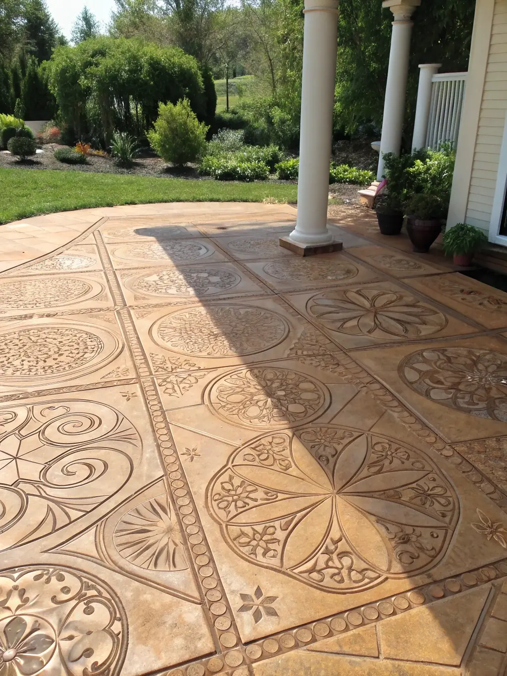 A freshly poured concrete patio with decorative stamped patterns and smooth finish, demonstrating JDI Contracting Group's concrete work quality.